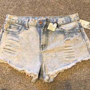 Light denim distressed shorts